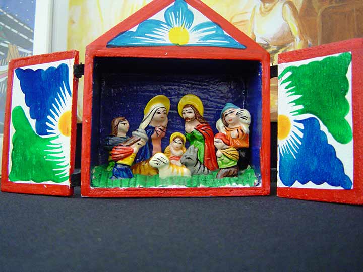 Brightly painted opening Nativity scene