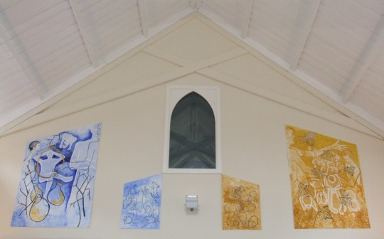 photograph of the church hall showing the four paintings